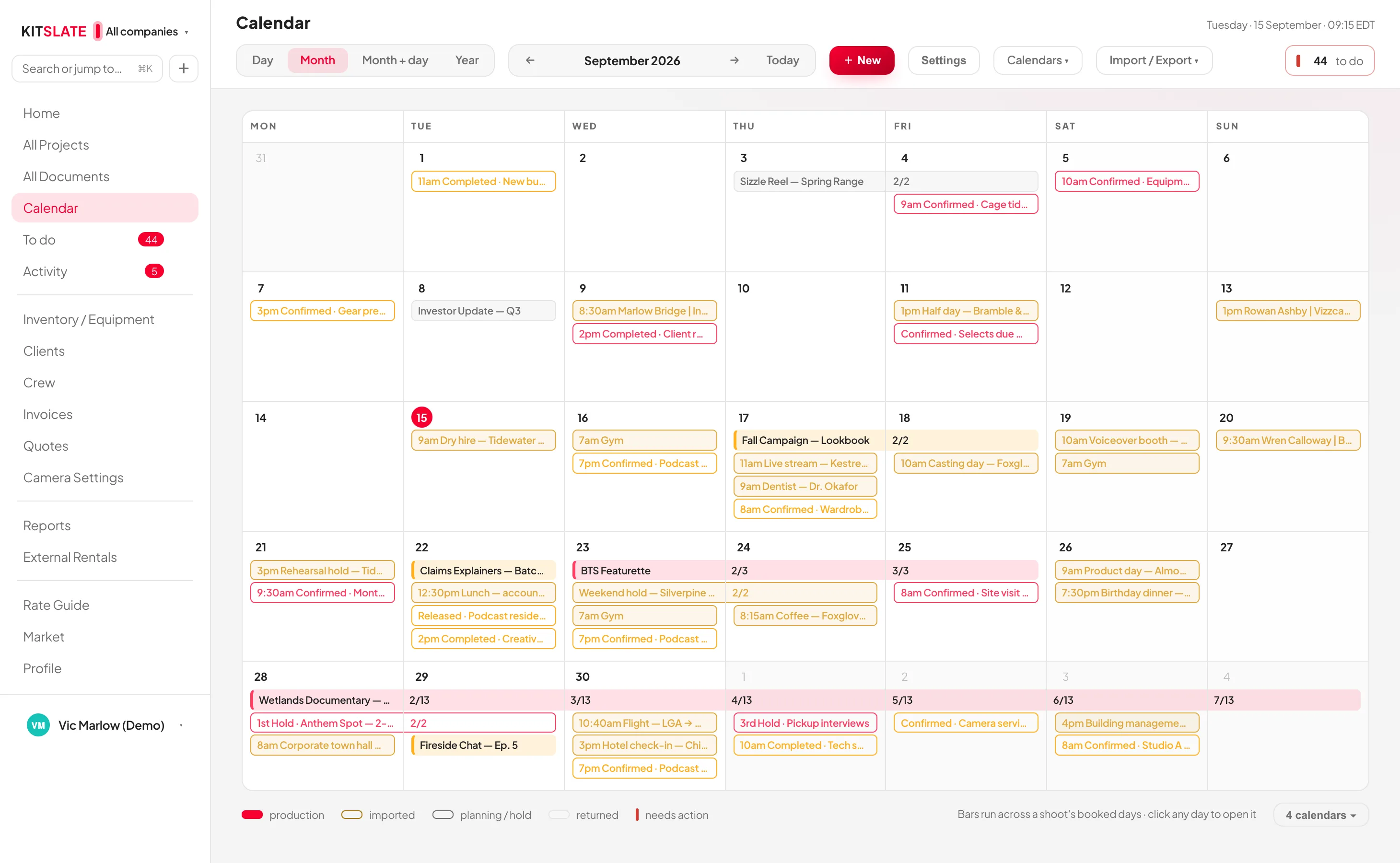 The KitSlate calendar in month view — every company in its own colour, confirmed shoots as solid bars, holds and pencils outlined, calendars imported from elsewhere shown as imported, and a legend naming each