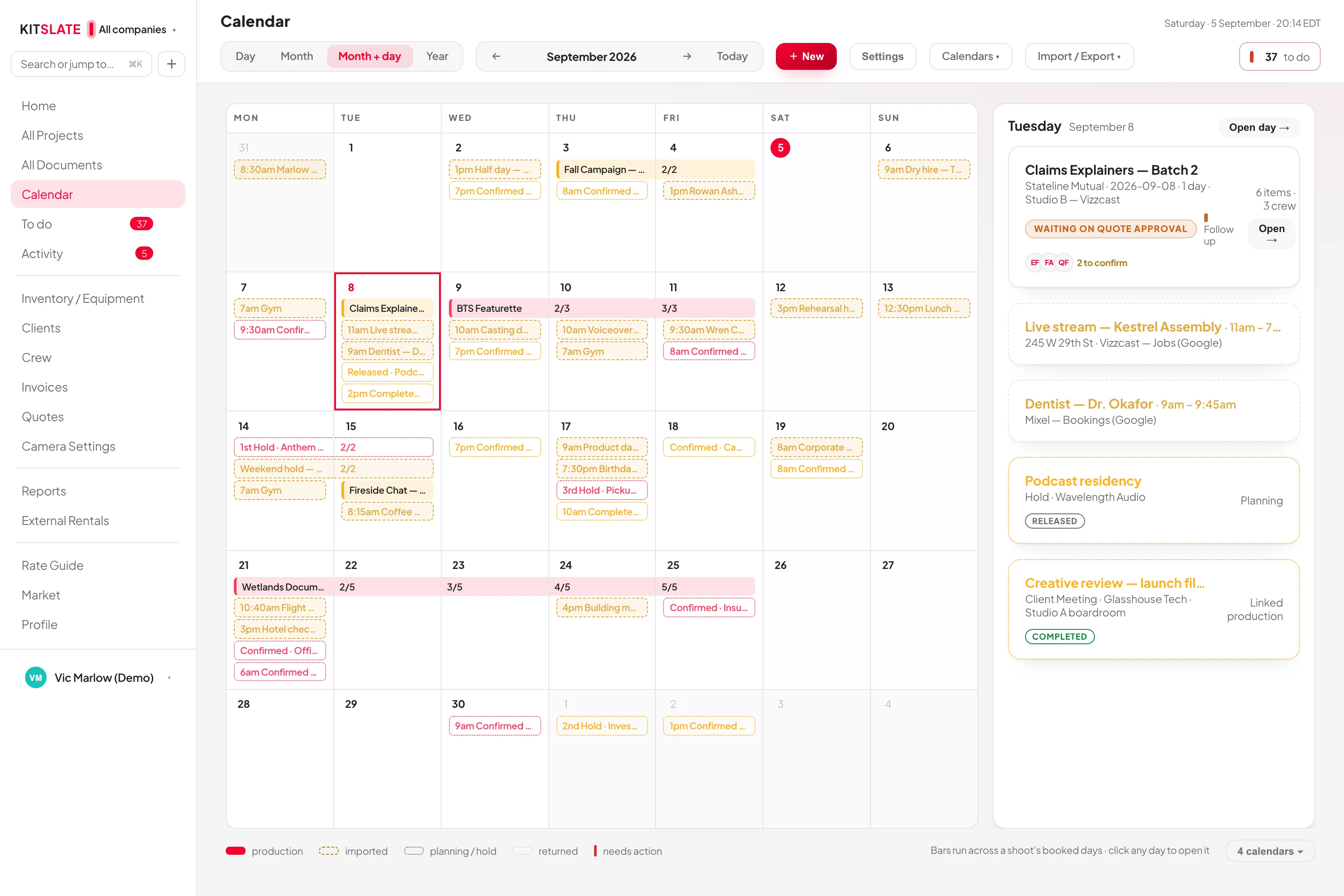 The KitSlate calendar in month view — bars running across each production's booked days, coloured by company